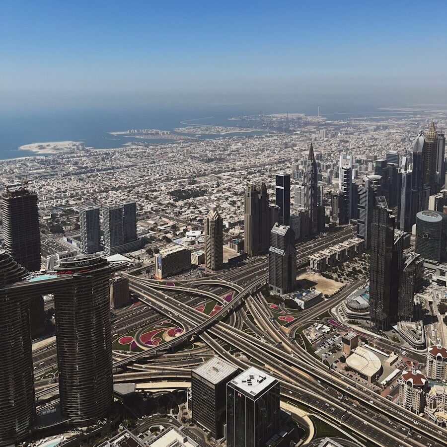 Aerial view of a sprawling modern city with highways.